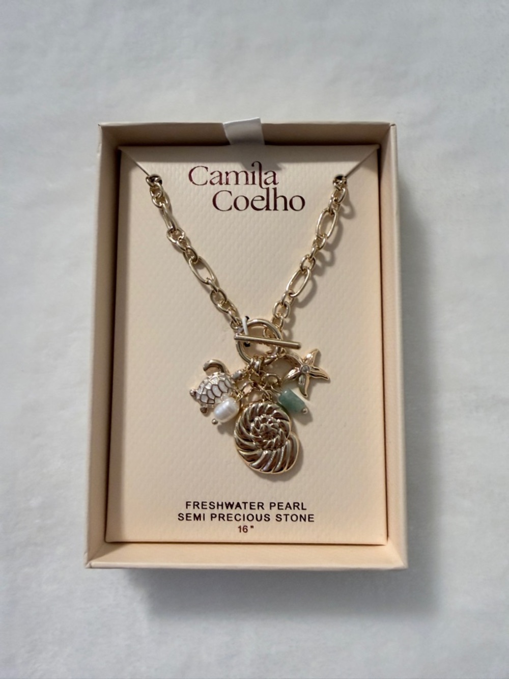 Camila Coelho Gold Charm Necklace with Pearl and Seashell Accents